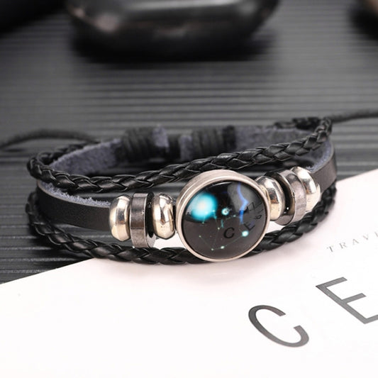 Black braided leather bracelet with silver-tone round charm and blue glow design