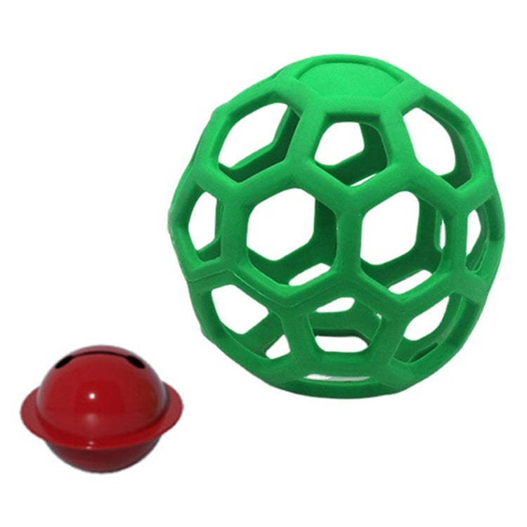 Green hollow rubber dog ball with geometric lattice cutouts and a small red bell toy
