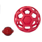 Red hollow rubber dog ball with geometric lattice cutouts and a small red bell toy