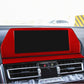 Red carbon-fiber navigation screen frame sticker installed on dashboard display