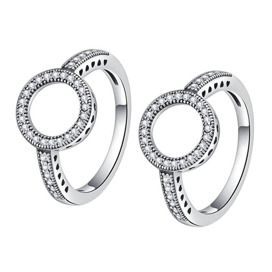 Pair of silver-tone halo circle rings with sparkling stones and cutout band design