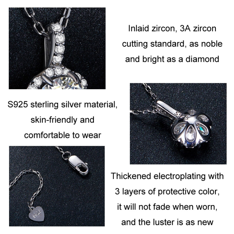 Sterling silver zircon pendant necklace close-up, prong-set round center with halo