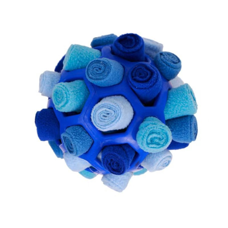 Blue plush dog sniffing ball with blue treat-feeding ball texture surface