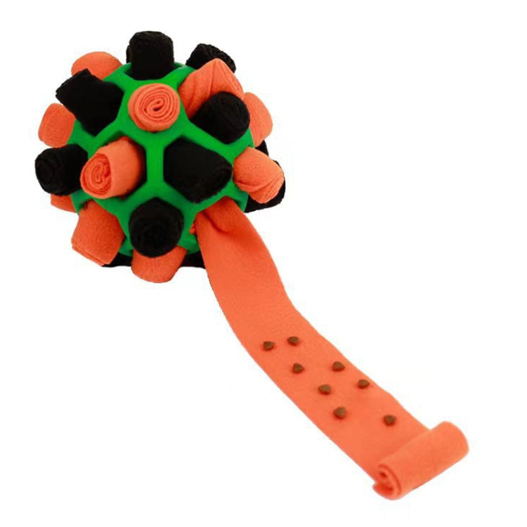 Green and orange plush dog sniffing ball with orange treat-feeding strip and kibble holes