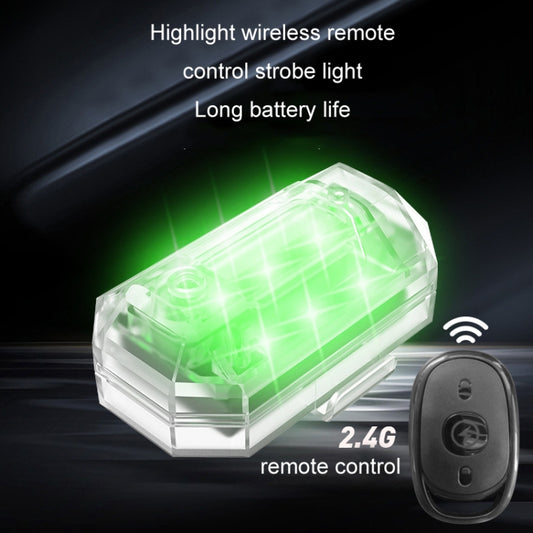 LED wireless strobe tail light with transparent housing glowing green and handheld remote