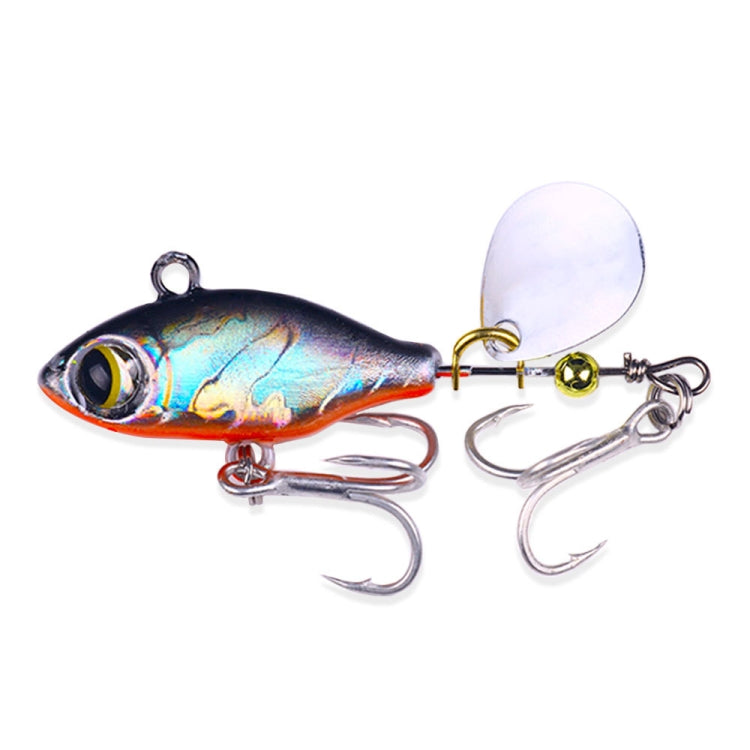 Sequin fishing lure with dark blue body, white spinner blade, twin treble hooks