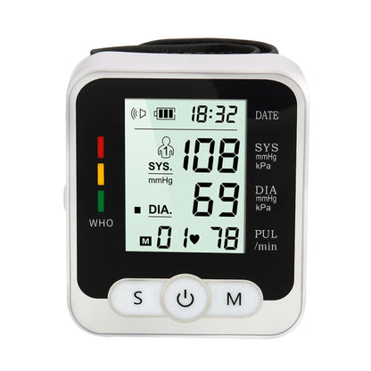 White wrist blood pressure monitor with digital LCD display and control buttons