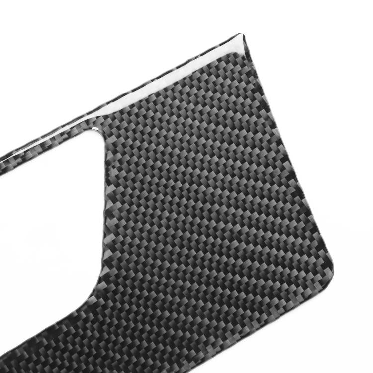 Close-up of carbon fiber weave dashboard speaker frame sticker in dark gray