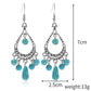 Turquoise teardrop chandelier earrings with bead fringe and silver-tone hooks