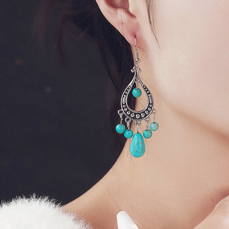 Turquoise teardrop chandelier earrings with dangling beads and silver-tone hooks