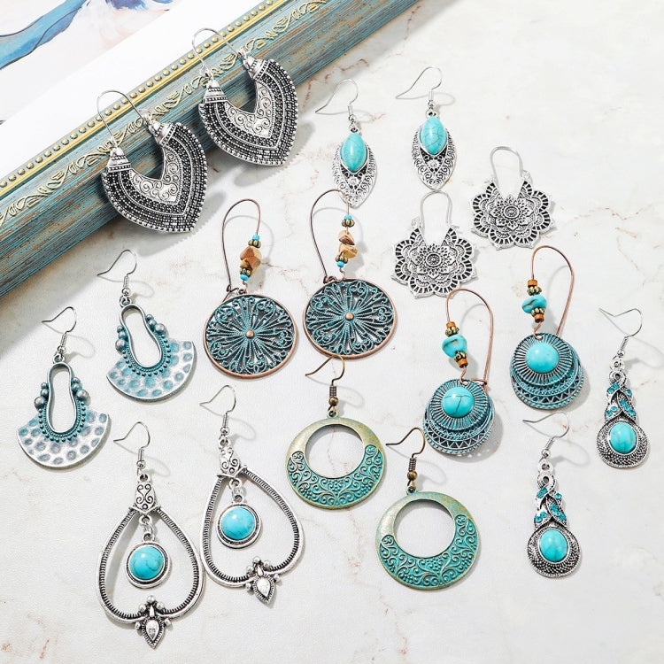 Turquoise boho earring assortment with various silver-tone designs and teardrop beads