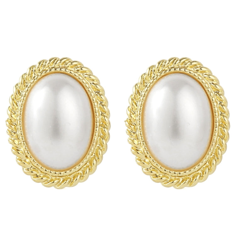 Gold ornate oval pearl stud earrings with glossy white oval center