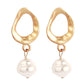 Gold teardrop hoop earrings with white pearl drop