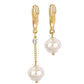 Gold dangle earrings with chain links, small crystal, and two white pearls