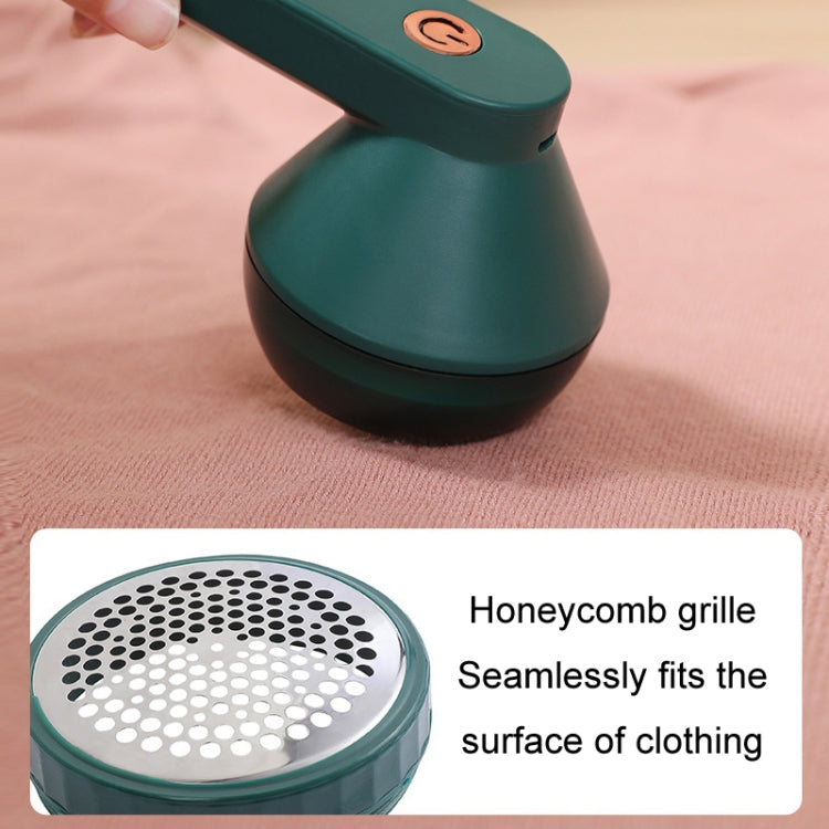 Green lint remover trimmer with honeycomb-style perforated grilles