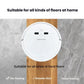 White robot vacuum with top logo and control panel, circular cleaning unit