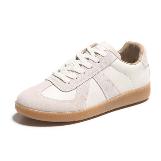 White and beige low-top lace-up sneakers with cushioned collar and gum sole