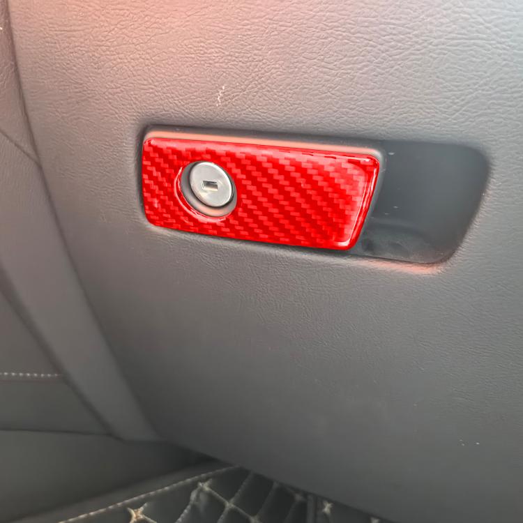 Red carbon fiber glove box handle sticker with circular cutout and center opening