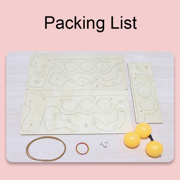 Wooden DIY table tennis kit pieces with yellow balls, elastic cord, and small parts