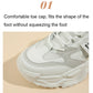 White lace-up sports shoe toe close-up with breathable mesh upper