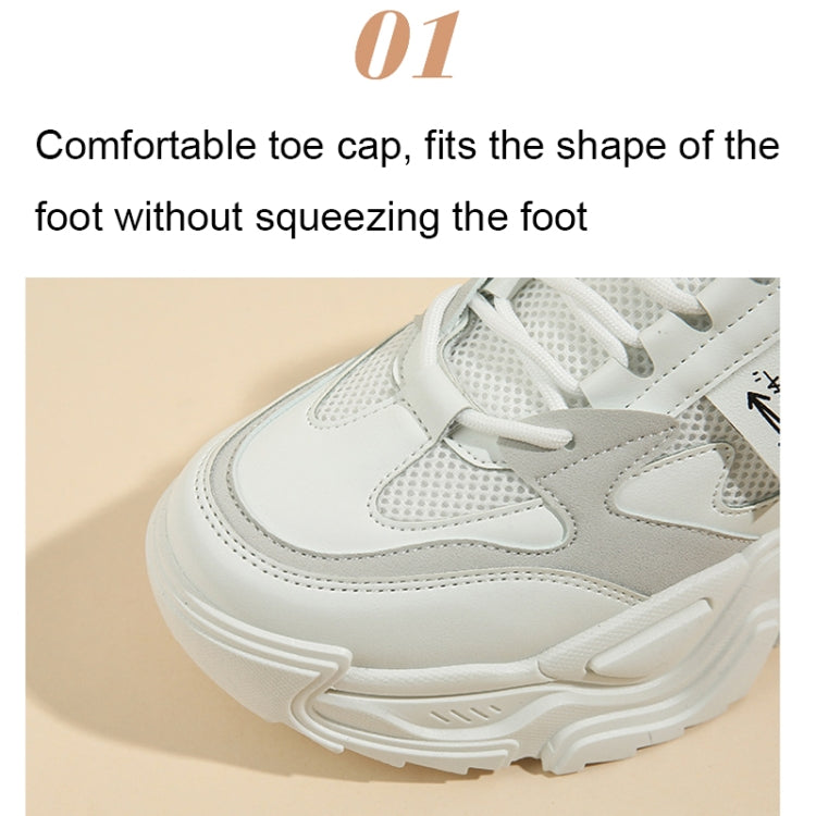 White lace-up sports shoe toe close-up with breathable mesh upper