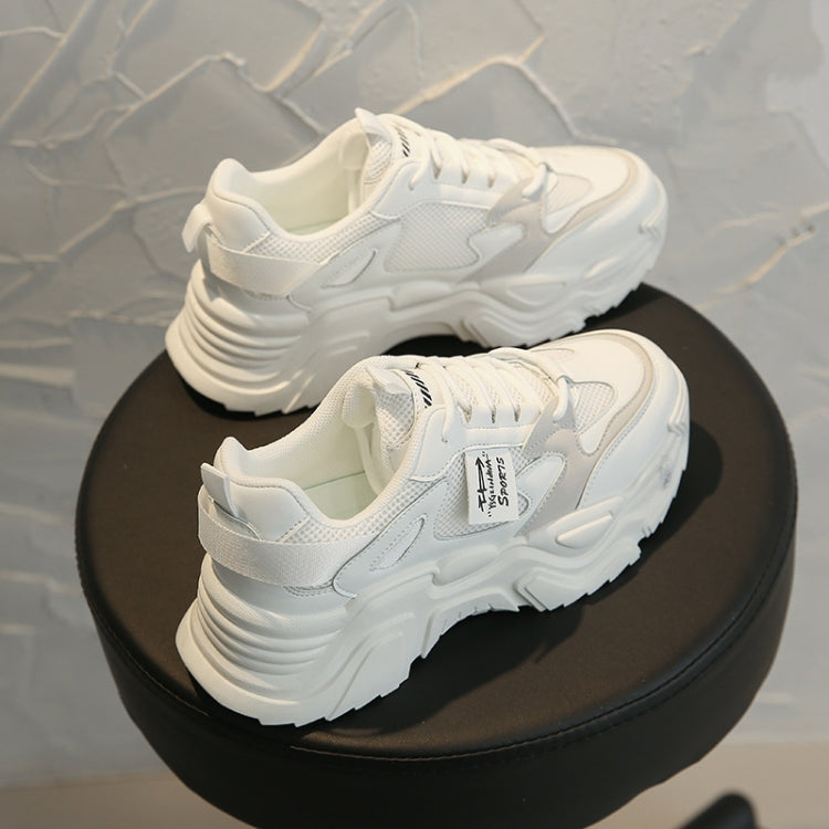 White chunky lace-up sports shoes with padded collar and thick rubber sole