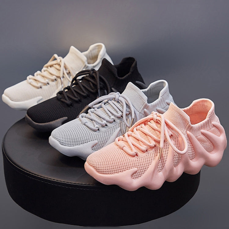 Pink and black knit lace-up sock sneakers with chunky tread and elastic collar
