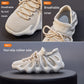 Beige knit sock sneakers close-up showing breathable mesh upper and lace-up front