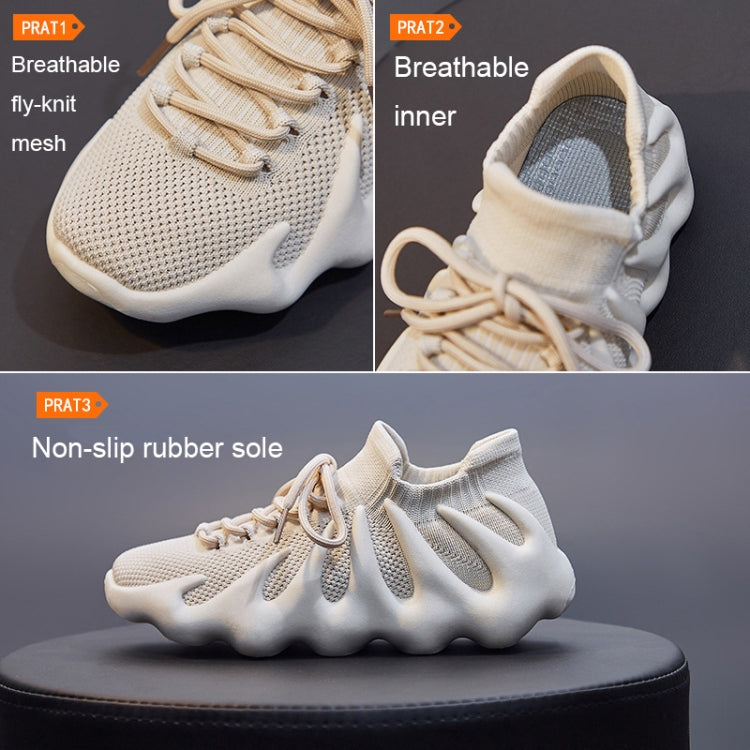 Beige knit sock sneakers close-up showing breathable mesh upper and lace-up front
