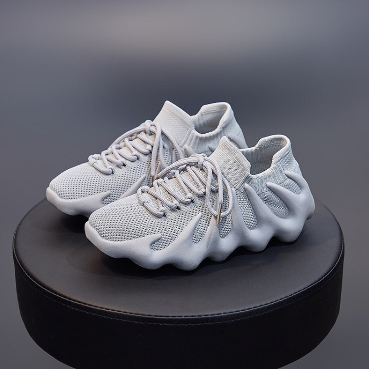 White lace-up sock shoes with mesh upper, sock collar, and cushioned wave sole