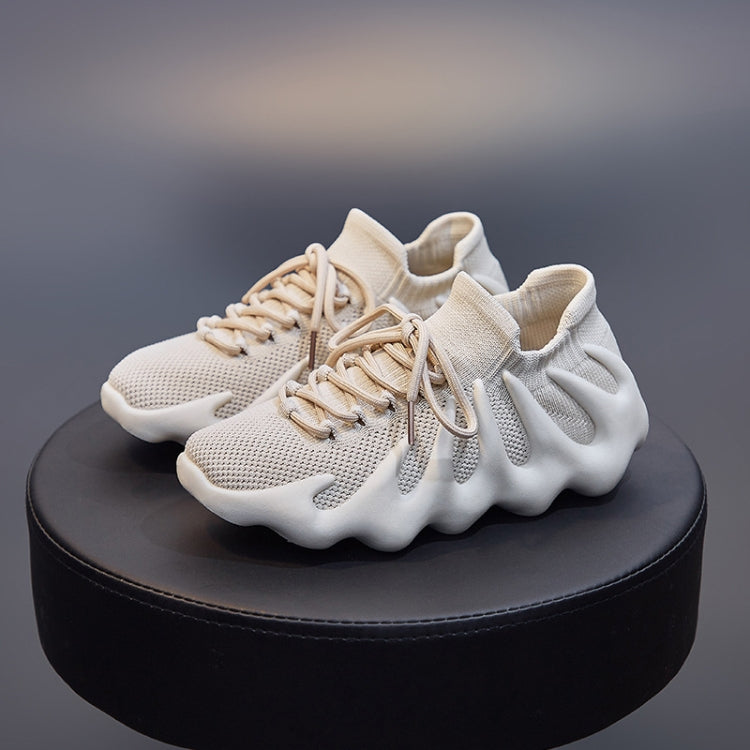 Beige woven sock shoes with lace-up closure, textured mesh upper, cushioned sole