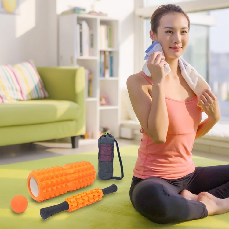 Orange foam roller set with orange massage ball and foam stick, stored in bag