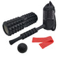Black foam roller set with black massage stick, ball, resistance bands, and carry bag