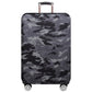 Dark gray camouflage dustproof suitcase cover on wheeled upright bag with handle cutout