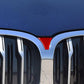 Front grille trim with red carbon-fiber triangular decorative insert, installed
