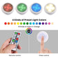 White circular night light with multi-color LED glow and handheld remote control