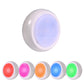 White circular bedside night light with glowing blue inner panel