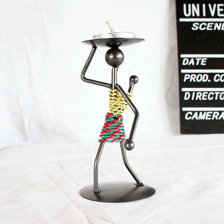 Man-shaped metal candlestick ornament with colorful coiled body and round base