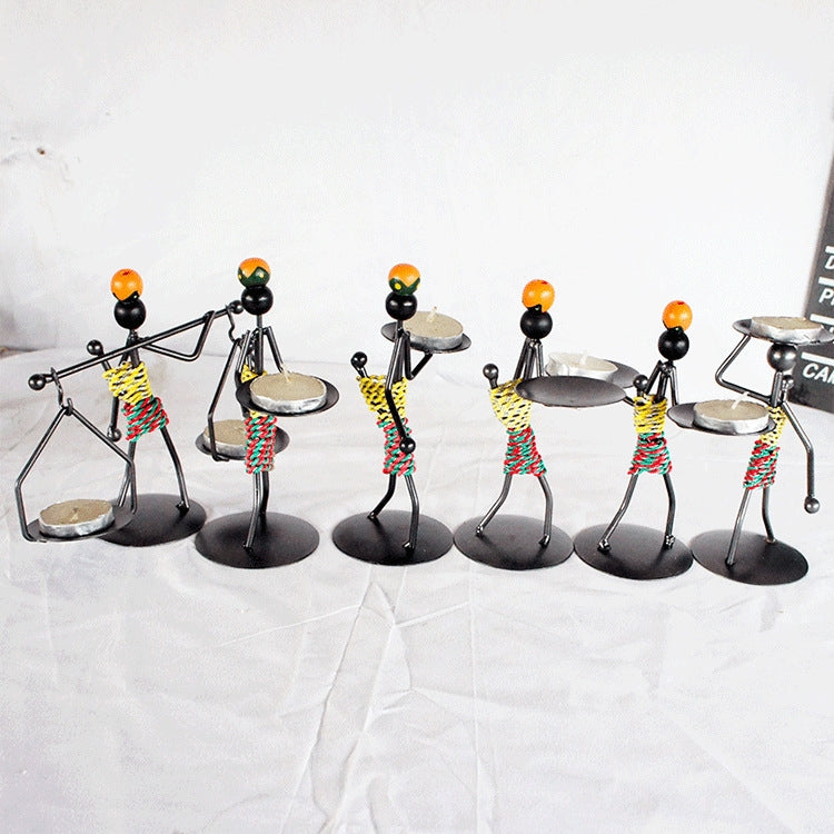 Set of man-shaped metal candlestick ornaments with colorful coiled bodies and trays