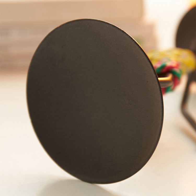 Round black base for man-shaped metal candlestick ornament