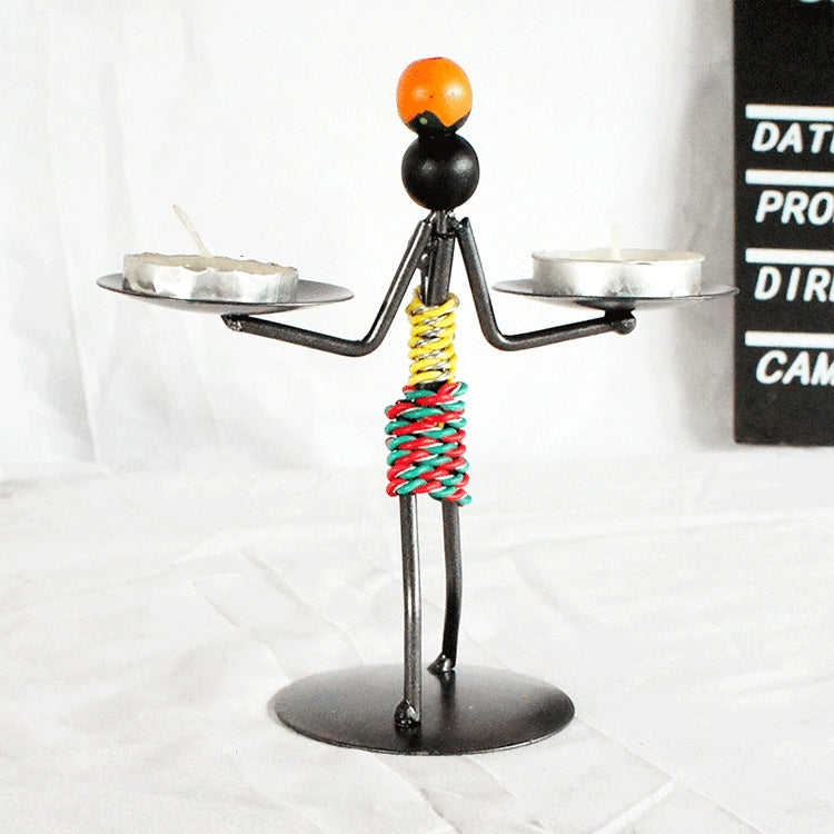 Man-shaped metal candleholder ornament with two trays, colorful coiled torso, base