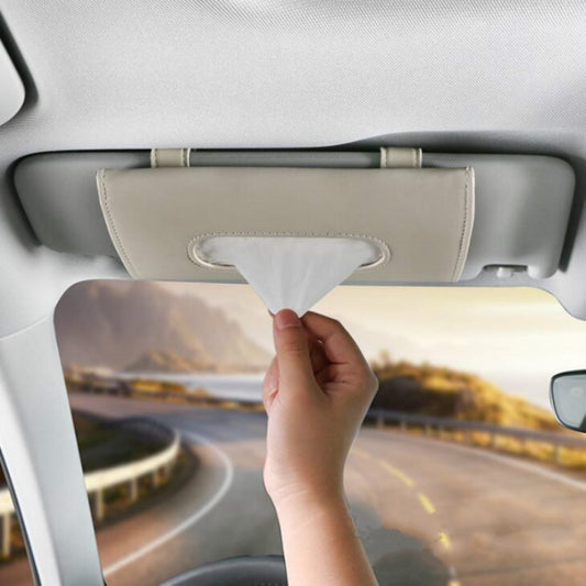 Beige car visor tissue holder with oval opening and tissue emerging