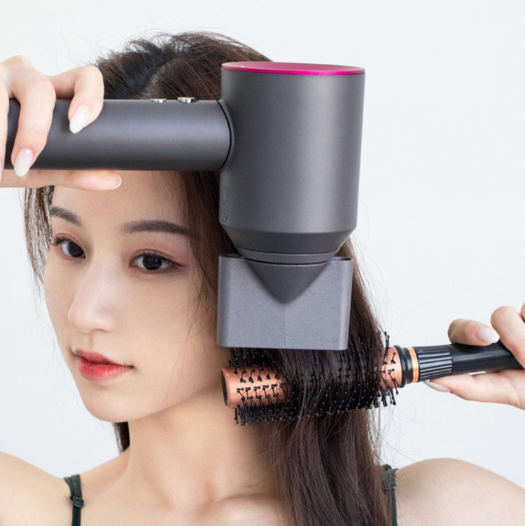 Dyson hair dryer with gray anti-flying nozzle attachment styling hair