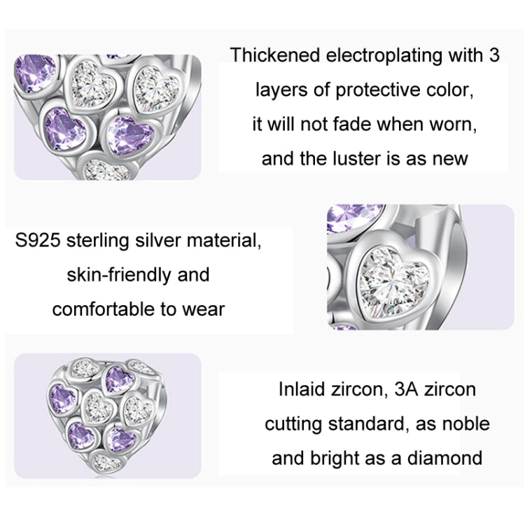 Close-up of heart-shaped silver bracelet bead with purple and clear zirconia stones