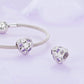 Mesh silver bracelet with heart-shaped zirconia charm featuring purple and clear stones