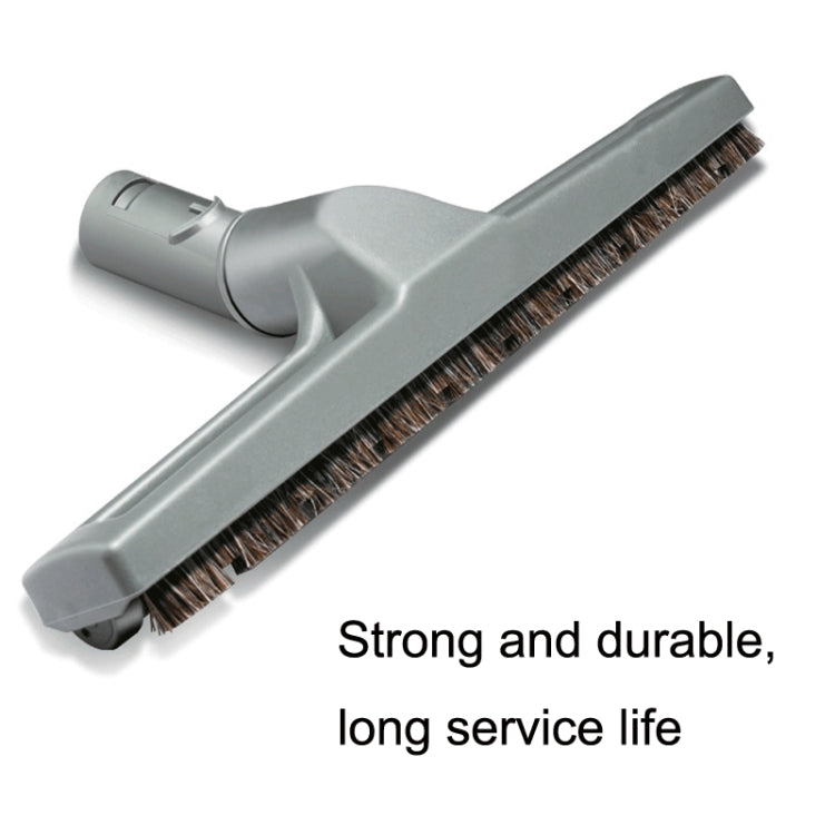 Wide vacuum floor brush with dense bristle strip and gray nozzle end