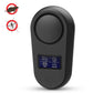 Black ultrasonic insect repellent device with circular top button and blue display.