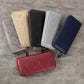 Set of embossed zip wallets in multiple colors, long coin purse style