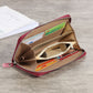 Red long zipper coin purse open, showing card slots and coin compartments