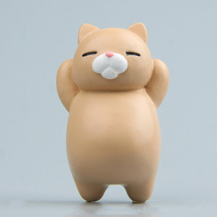 Cream cartoon cat resin fridge magnet, standing figure with pink nose and closed eyes.